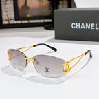 Gold-tone aviator sunglasses with light gray lenses and Chanel emblem on the lens
