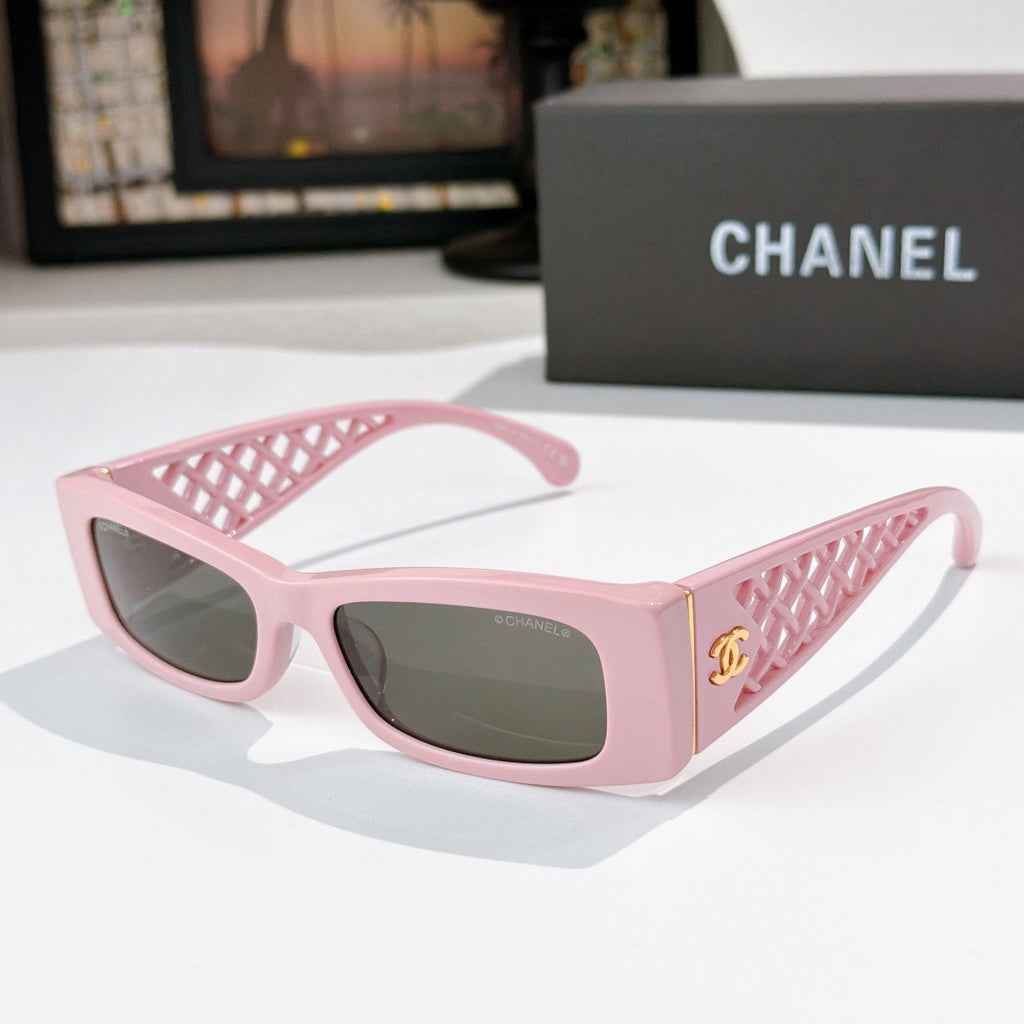 Chanel sunglasses, pink frames with dark lenses and lattice temple details