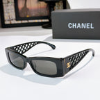 Chanel sunglasses, black frames with dark lenses and lattice temple panels