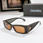 Chanel sunglasses, black frames with amber lenses and lattice temple accents