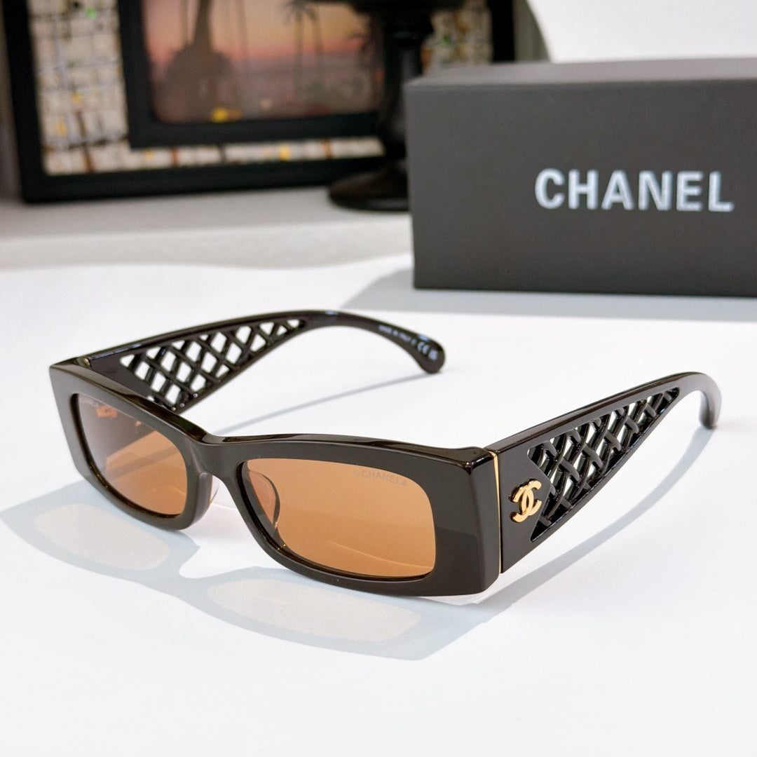 Chanel sunglasses, black frames with amber lenses and lattice temple accents