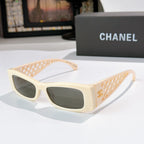 Chanel sunglasses, cream frames with dark lenses and gold-tone lattice temples