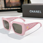 Square sunglasses with pink frames, lattice temple and dark gray lenses