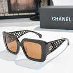 Square sunglasses with dark frames, lattice temple and amber-tinted lenses