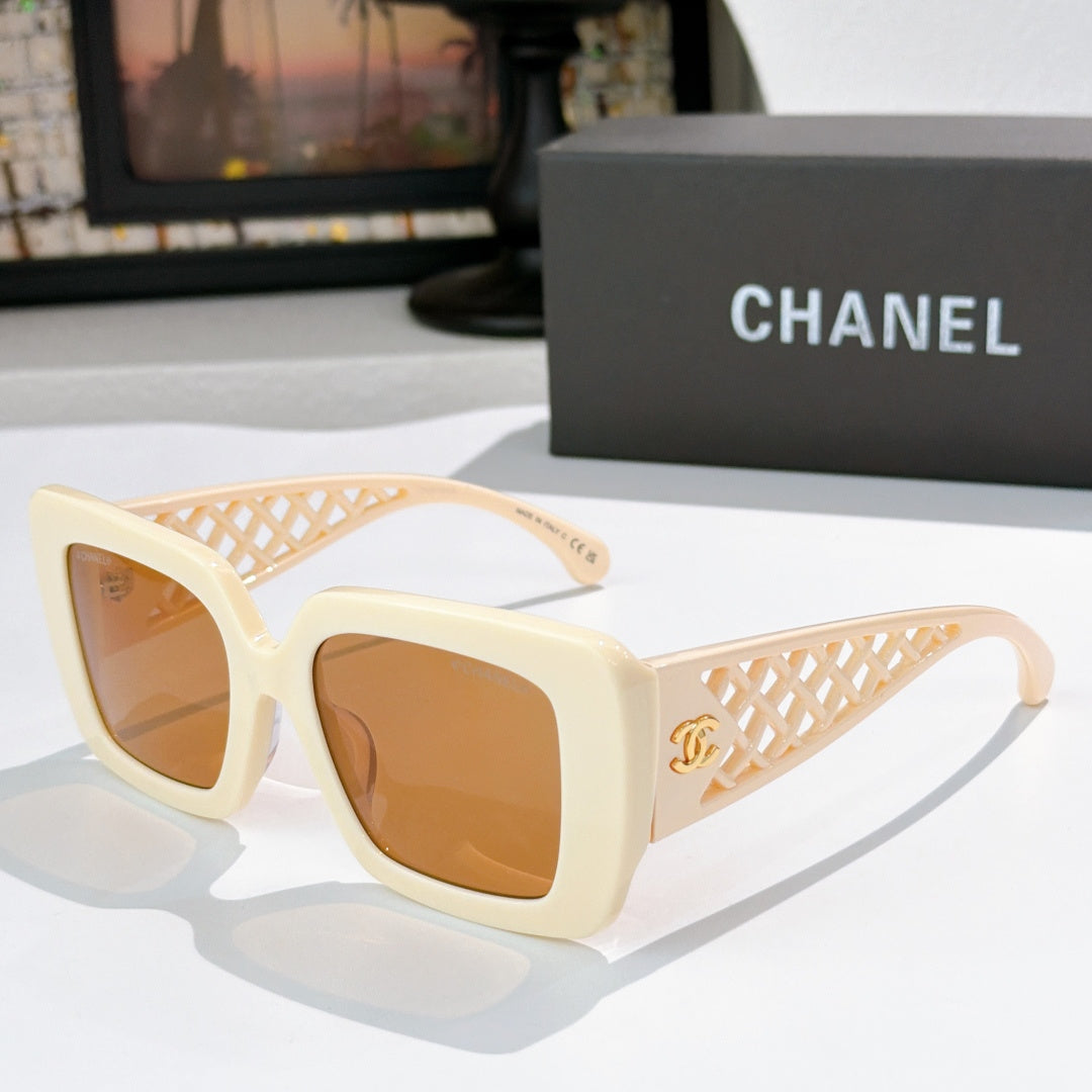 Square sunglasses with cream frames, lattice temple and amber-tinted lenses