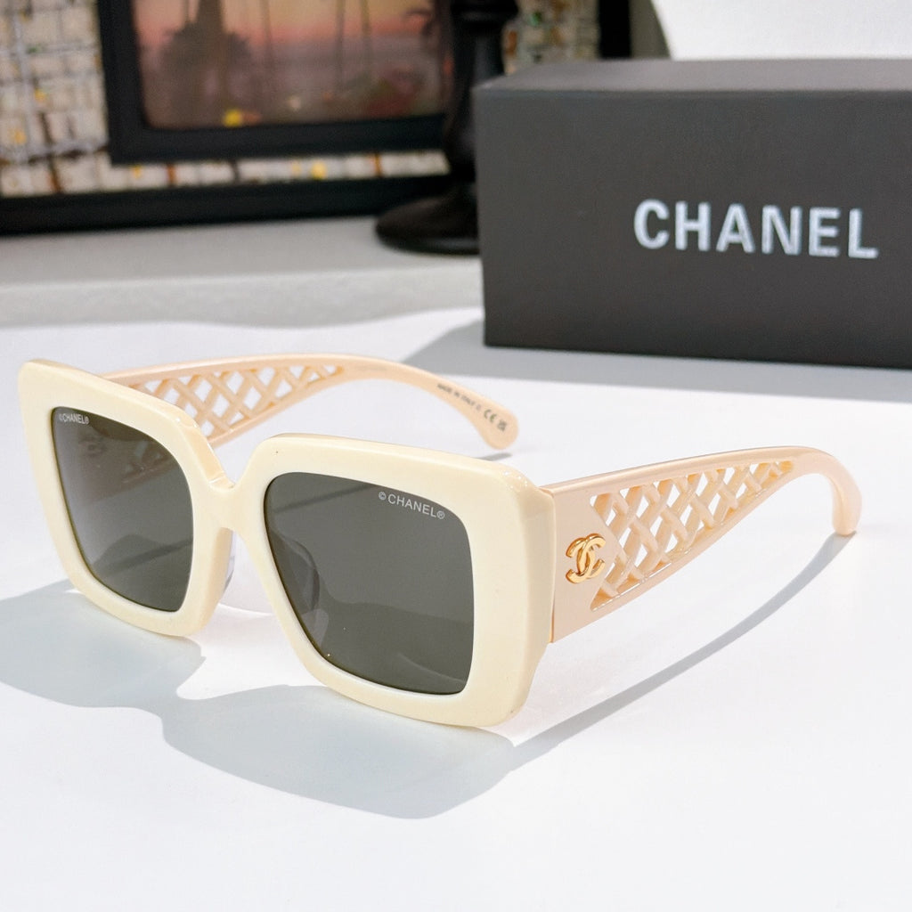 Square sunglasses with cream frames, lattice temple and dark lenses