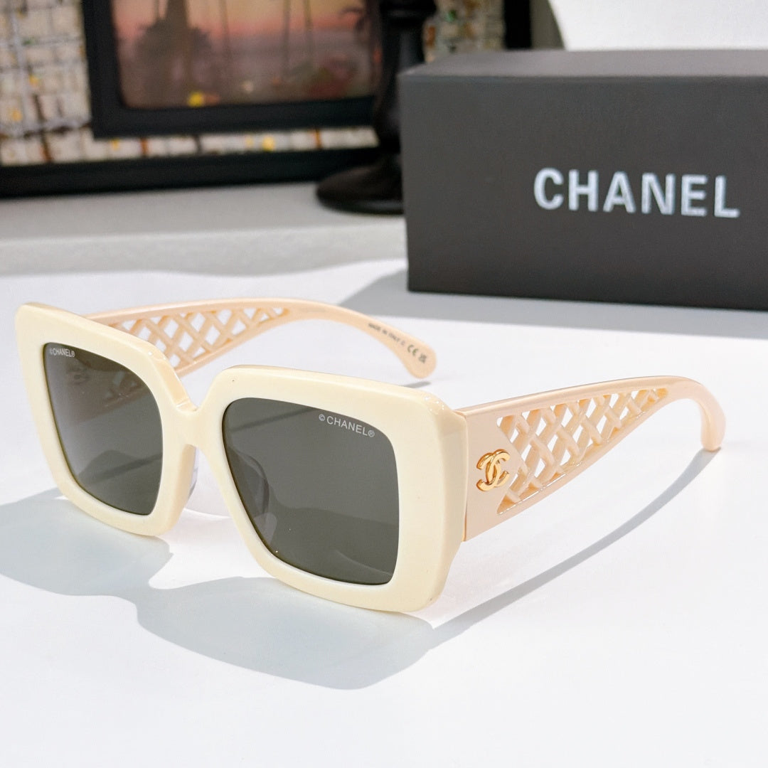 Square sunglasses with cream frames, lattice temple and dark lenses