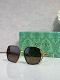 Sunglasses with dark maroon square frames and blue tinted lenses, gold-tone accents