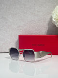 Square sunglasses with tinted lenses, dark frame, gold-tone arms