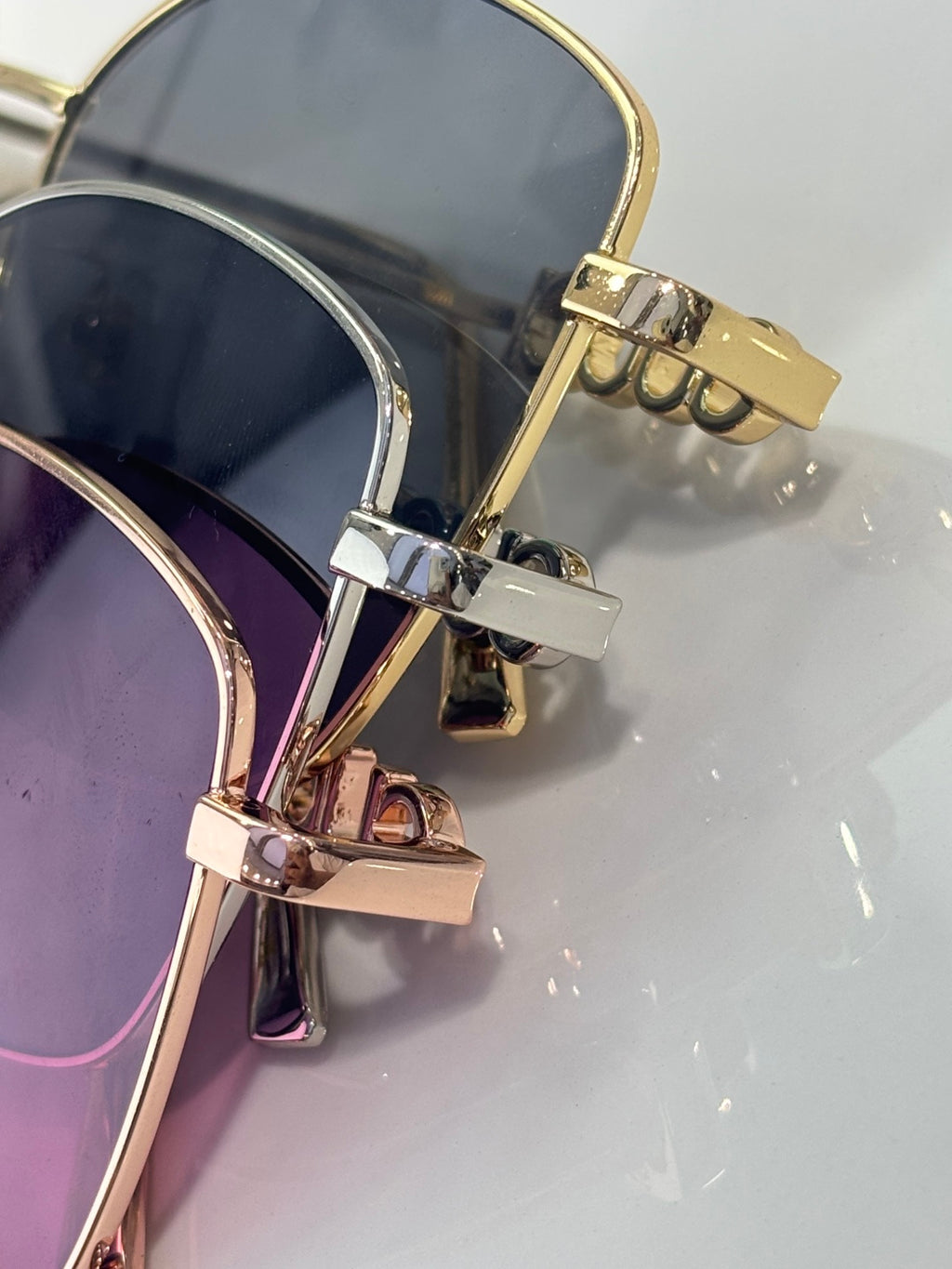 Sunglasses with stacked lenses and gold-tone hinges