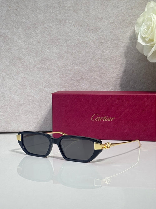 Cartier eyeglasses with dark blue acetate frames and gold-tone cat logo arms