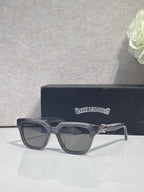 Clear-gray square sunglasses with dark lenses and gold hinge detail