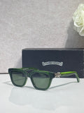 Green square sunglasses with dark lenses and gold logo on temples