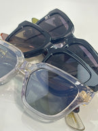 Chrome glasses showing clear lenses and dark navy frames from above