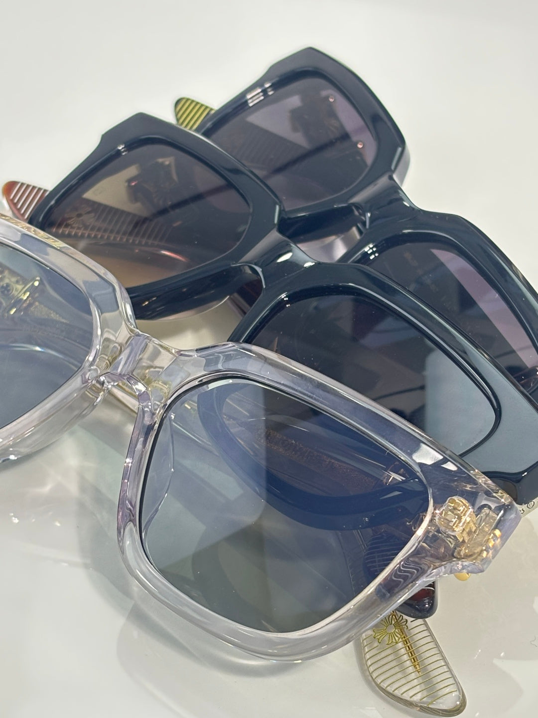 Chrome glasses showing clear lenses and dark navy frames from above