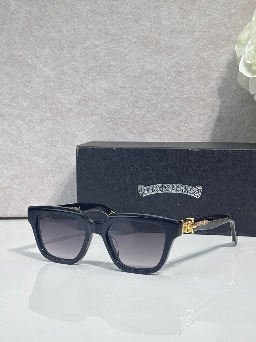 Chrome glasses with dark navy frames and clear lenses, front angled view