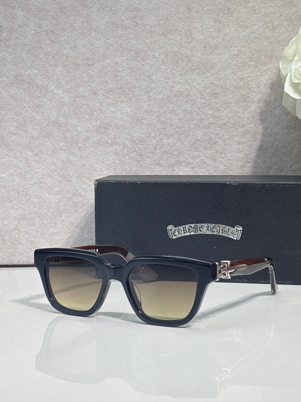 Chrome glasses with dark navy frames and clear lenses, front view