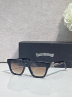 Chrome glasses with dark navy frames and clear lenses, front on display case