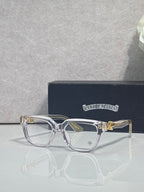 Transparent purple full-rim eyeglasses with clear lenses and ornate gold accents
