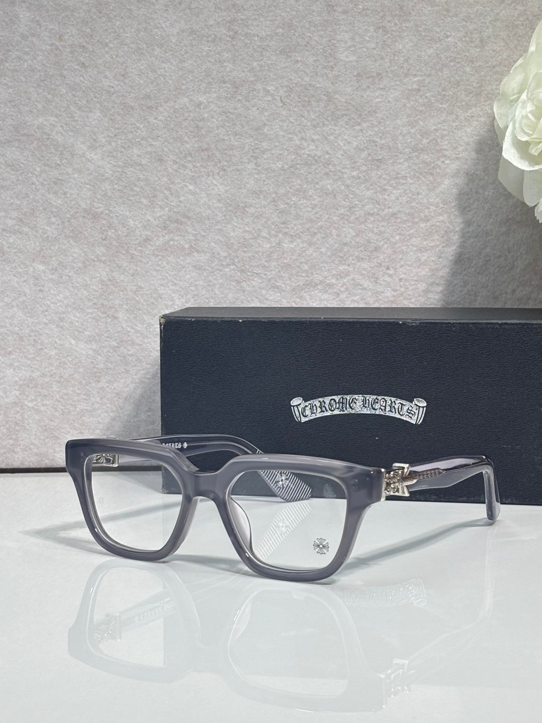 Navy full-rim eyeglasses with clear lenses and subtle logo on the temple