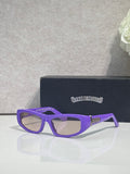 Chrome glasses with purple frames and clear lenses, with star-style metal details on temples.