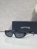 Chrome glasses with dark frames and neutral-tinted lenses, featuring star metal details on temples.