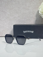 Chrome-rim square sunglasses with dark lenses and black frame, clear temple