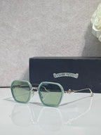 Chrome-rim square sunglasses, teal lenses and green frame with clear temple tips