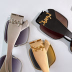 Assorted sunglasses with silver, black, and gold frames and tinted lenses