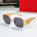 Gold-tone octagonal sunglasses with dark blue lenses and slim metal temples