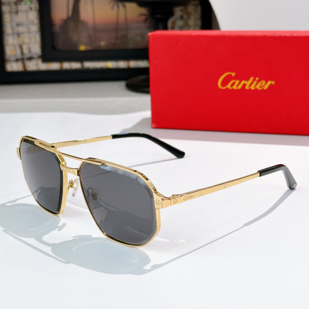 Sunglasses with gold-tone frame and dark gray lenses, angled side view
