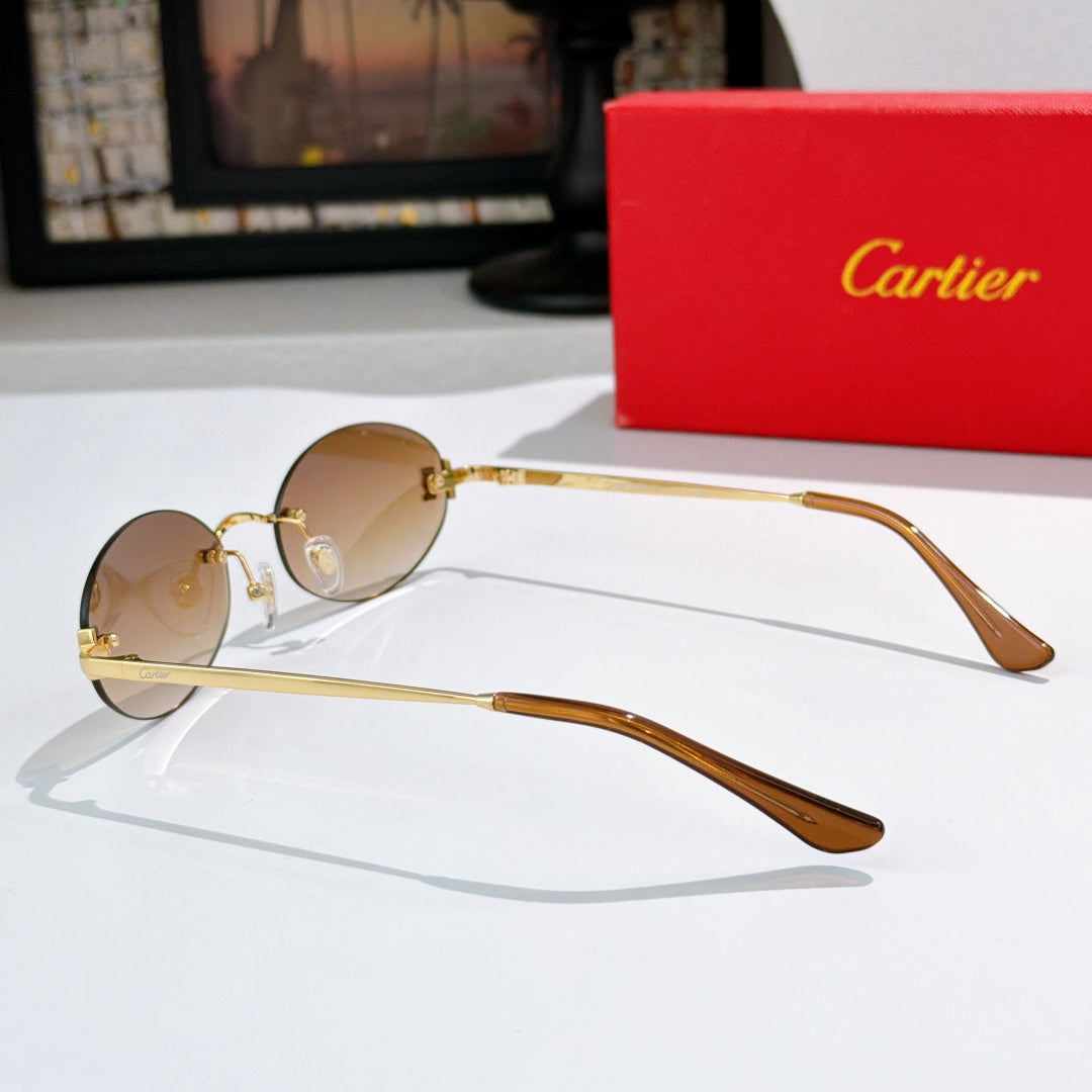 Cartier round sunglasses in gold with brown temples and light tan tinted lenses