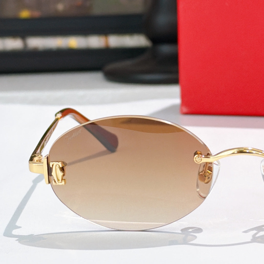 Cartier round sunglasses close-up with gold frame and tan tinted lenses