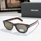Prada sunglasses with tortoiseshell frames and brown lenses
