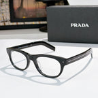 Prada eyeglasses with black frames and clear lenses