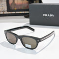 Prada sunglasses with black frames and dark brown lenses