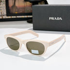 Prada sunglasses with white frames and green-tinted lenses