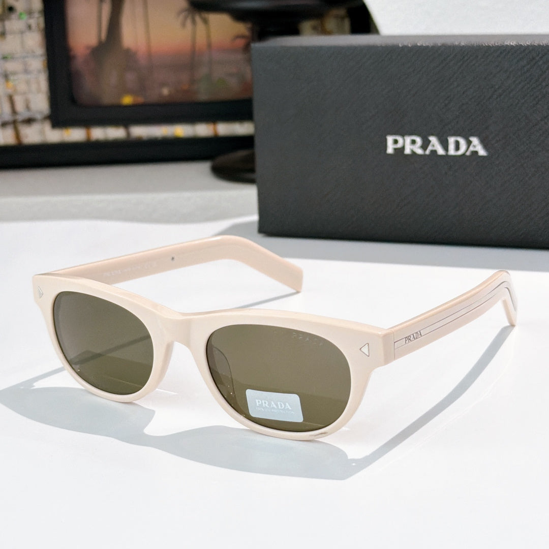 Prada sunglasses with white frames and green-tinted lenses