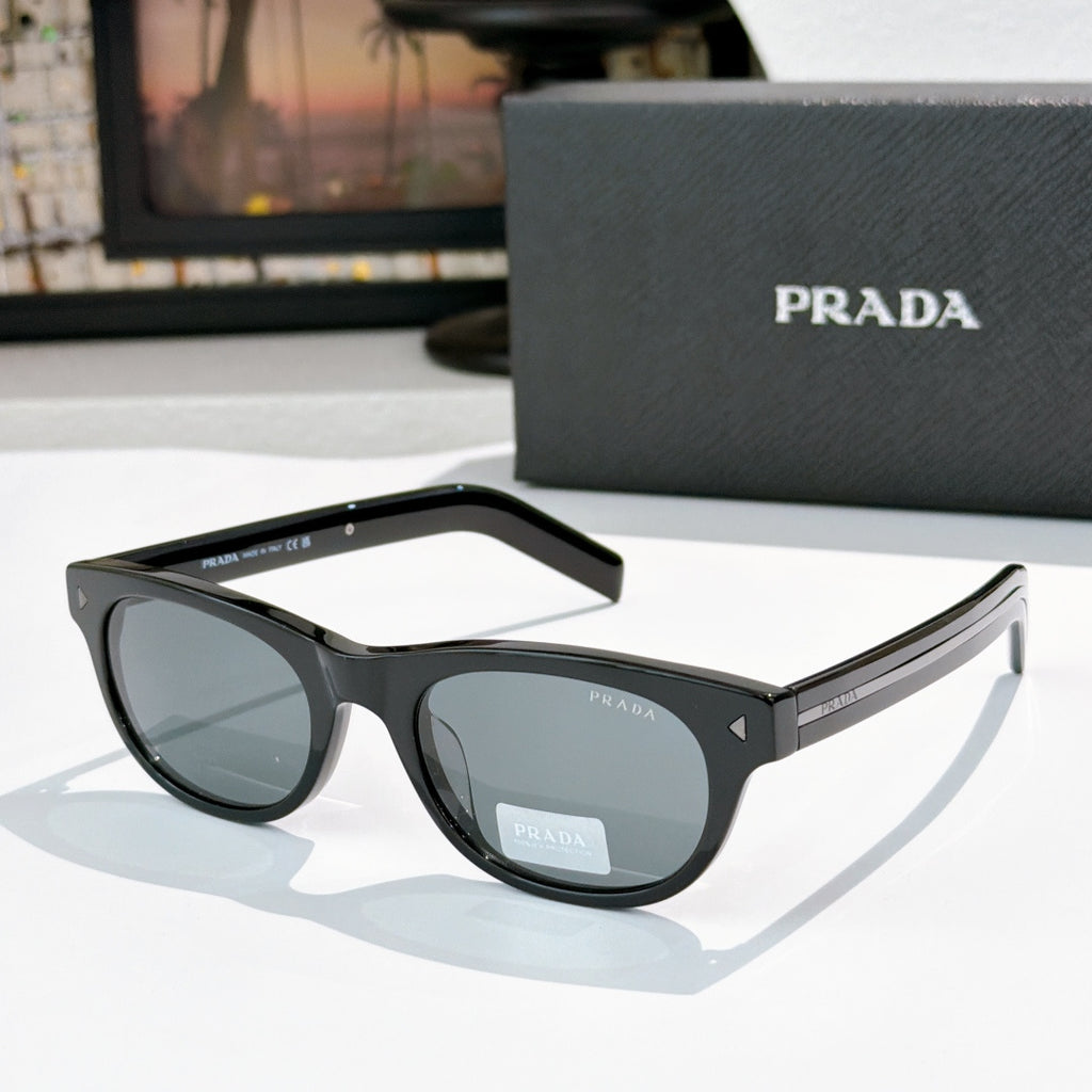 Prada sunglasses with black frames and gray-tinted lenses