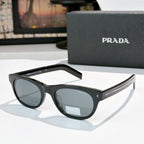 Prada sunglasses with black frames and gray-tinted lenses