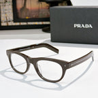 Prada eyeglasses with dark brown frames and clear lenses