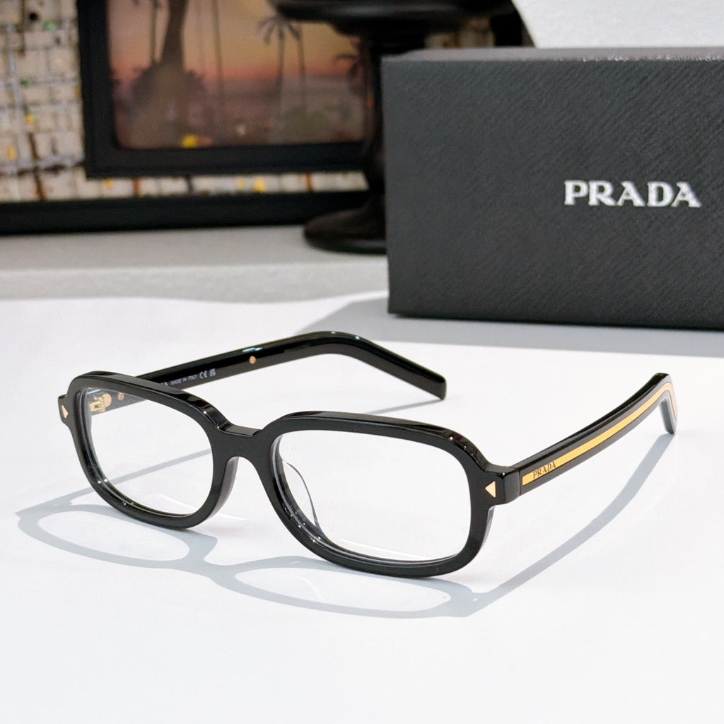 Prada eyeglasses with black frames and clear lenses with gold accents