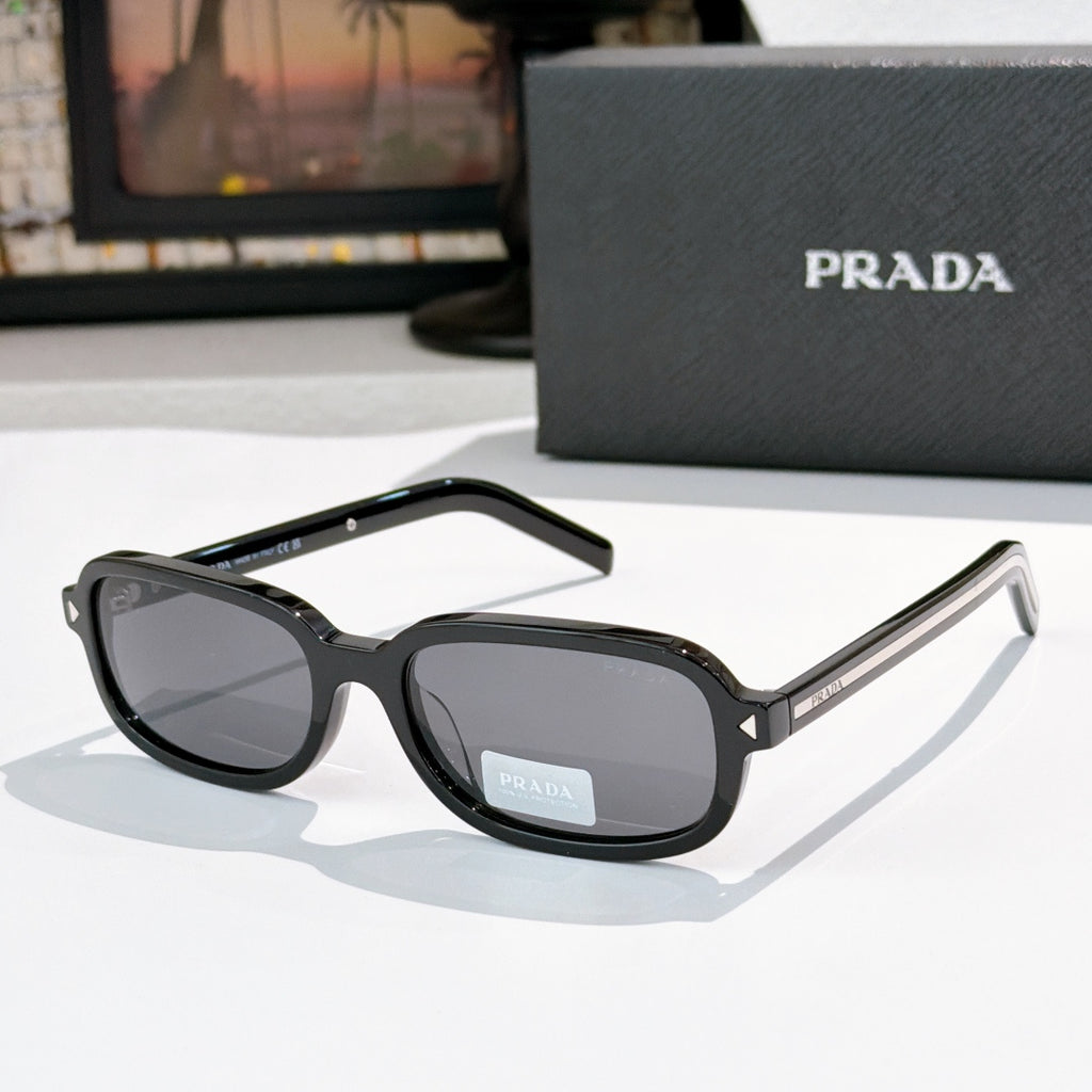Prada sunglasses with black frames and dark gray-tinted lenses