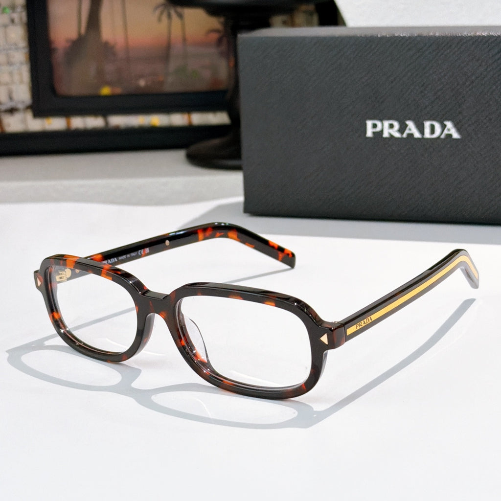 Prada eyeglasses with tortoiseshell frames and clear lenses