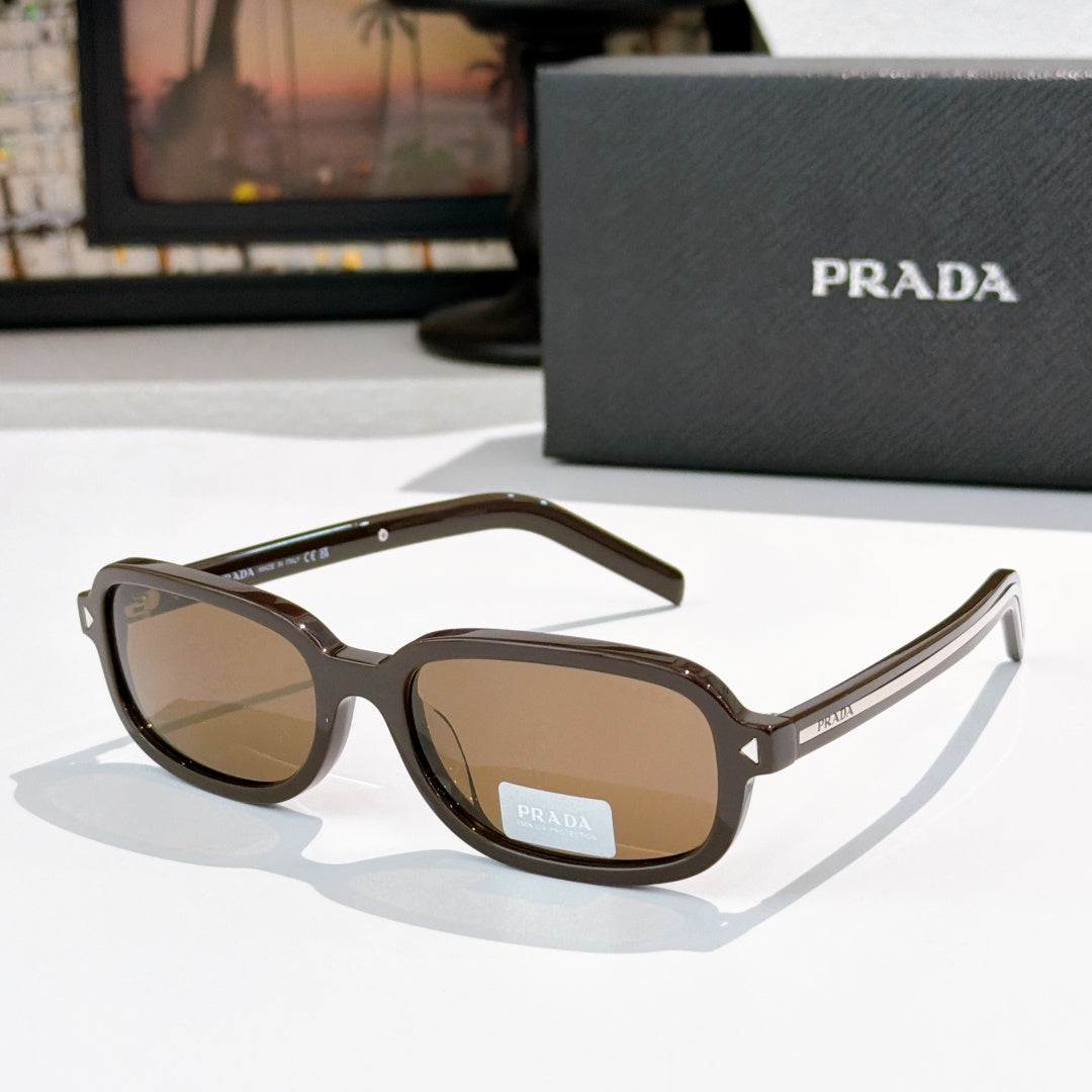 Prada sunglasses with dark brown frames and brown-tinted lenses
