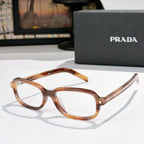 Prada eyeglasses with amber translucent frames and clear lenses