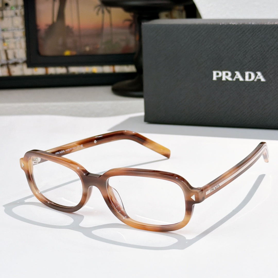 Prada eyeglasses with amber translucent frames and clear lenses