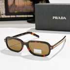 Prada sunglasses with tortoiseshell frames and brown-tinted lenses