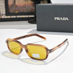 Prada sunglasses with amber frames and yellow-tinted lenses
