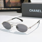 Silver round sunglasses with gray lenses, rhinestone chain on temples
